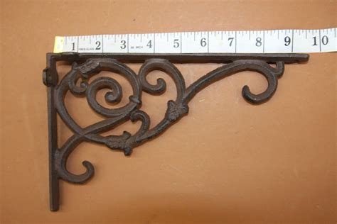 large metal bracket decorative|ornate metal shelf brackets.